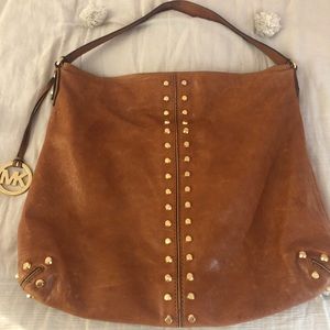 Authentic Michael Kors gold studded hobo bag.